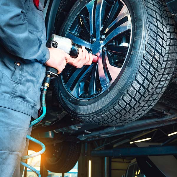 Tires fitting at the car service station