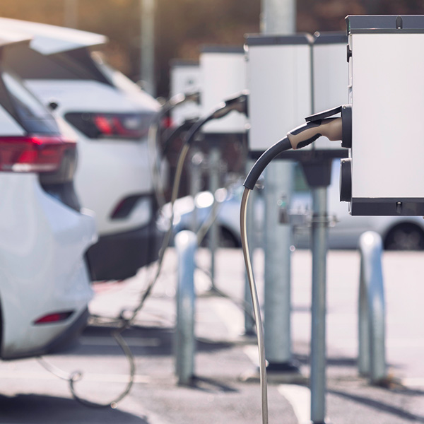 A parking lot with charging stations for electric cars